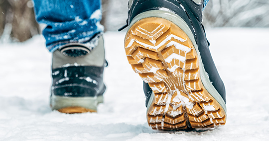 Remove the snow from the soles of your shoes